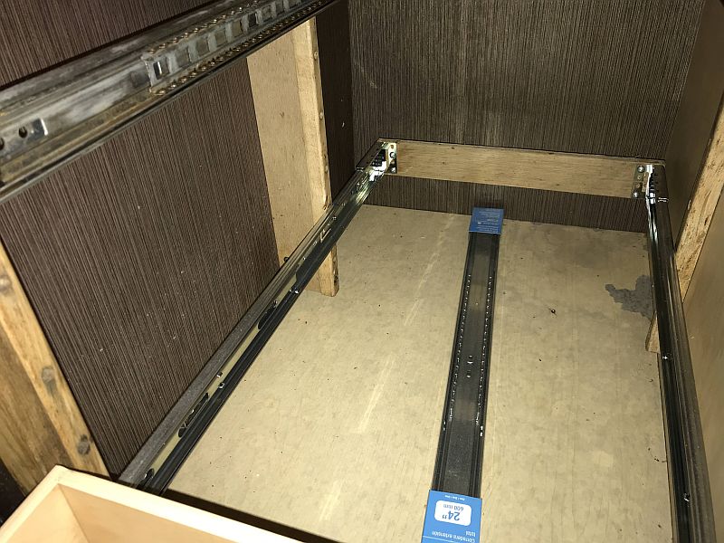 Inspecting an RV for flood damage. The slide for the bottom drawer of the pantry had been replaced, but the replaced for the rusted second drawer slide was found still in the box. #thervinspector